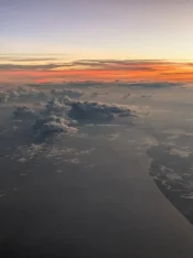 sunset during the flight in.webp